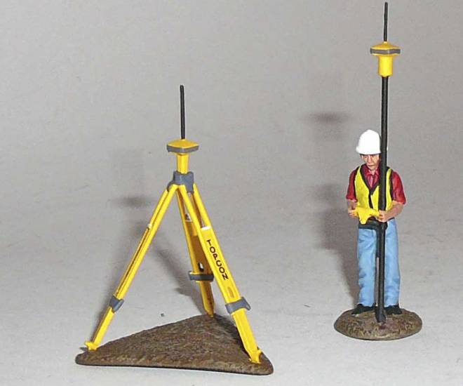 Bauarbeiter mit Topcon Laserausrüstung
